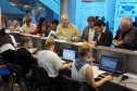 У стенда регистрации участников и посетителей постоянно было оживленно