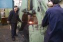 И производит удар гигантским молотом пресса