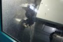 На фото: работа токарного двухшпиндельного обрабатывающего центра для обработки деталей золотниковой группы