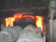 После остывания готовые отливки отбивают от спекшегося песка в печи