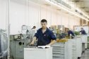 Молодой токарь за работой